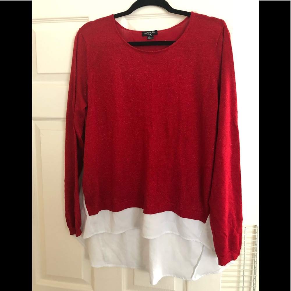 Red sweater with partial white shirt hanging